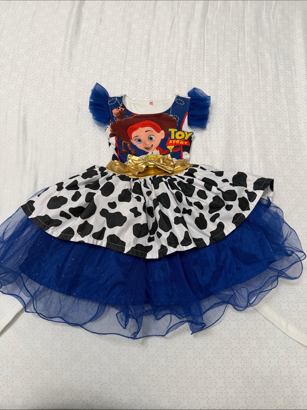 Disney insp Blue Tulle Jessie Character Dress with Cow-Print Skirt and Gold Bow